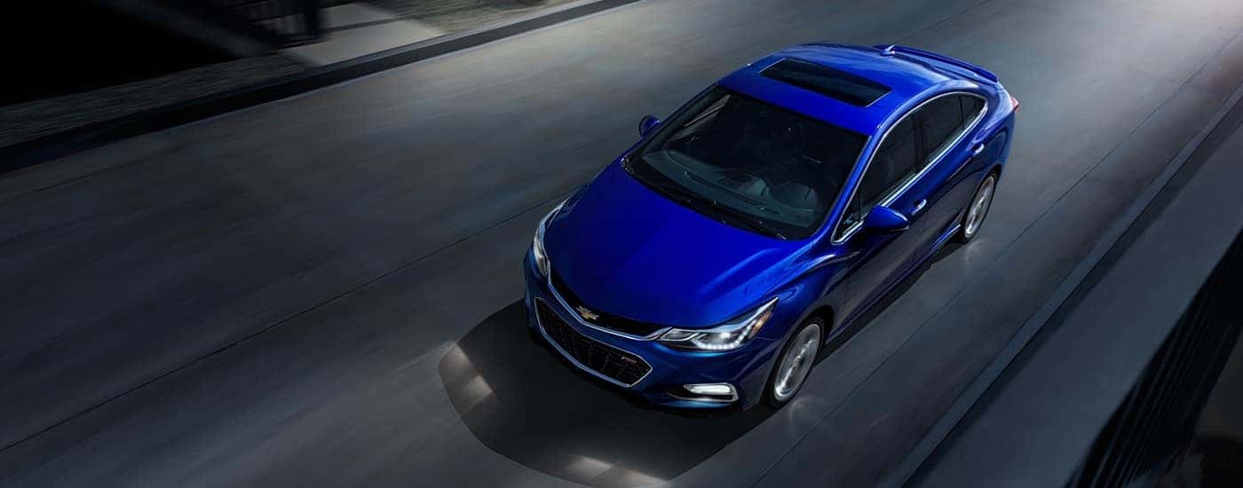 A 2016 Chevy Cruze RS is driving to look at used cars for sale near Mason.