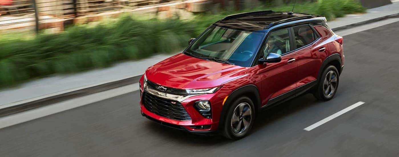 A red 2021 Chevy Trailblazer RS driving to view used cars for sale near Fairfield.