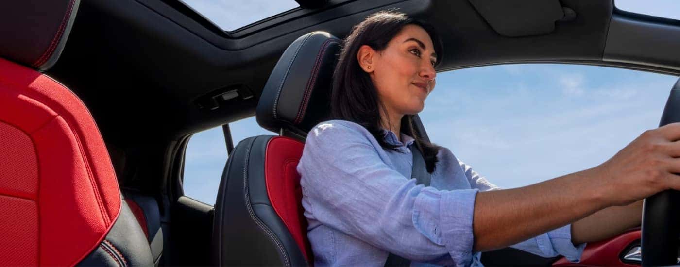 A person driving a 2025 Chevy Equinox EV.