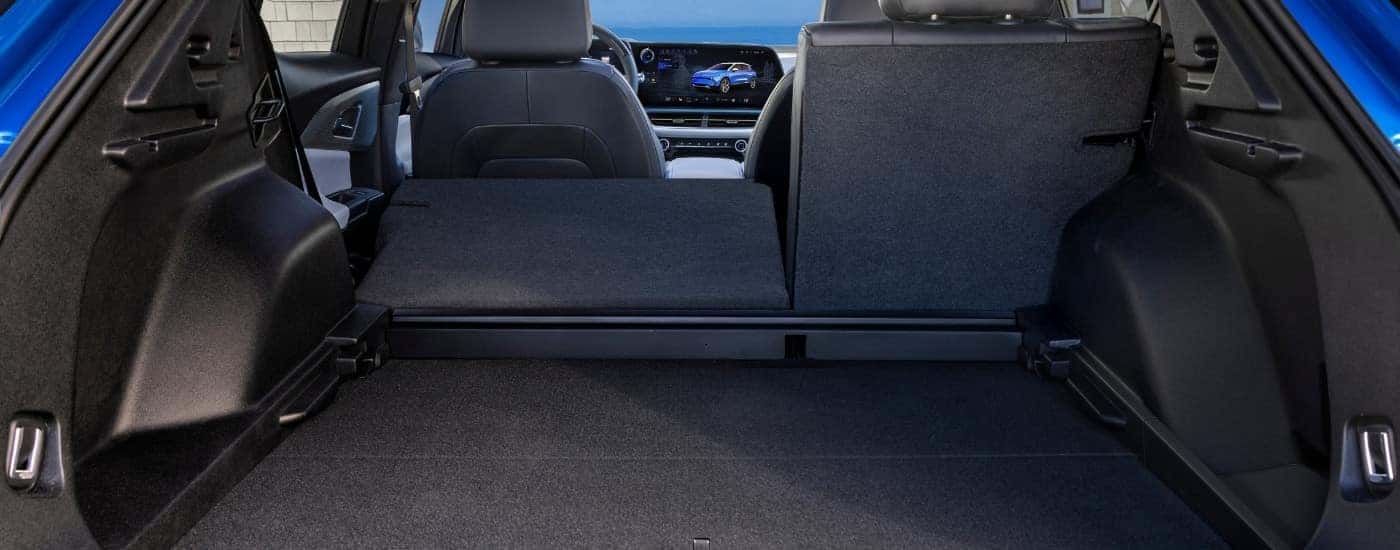 Rear cargo area in a blue 2025 Chevy Equinox EV.