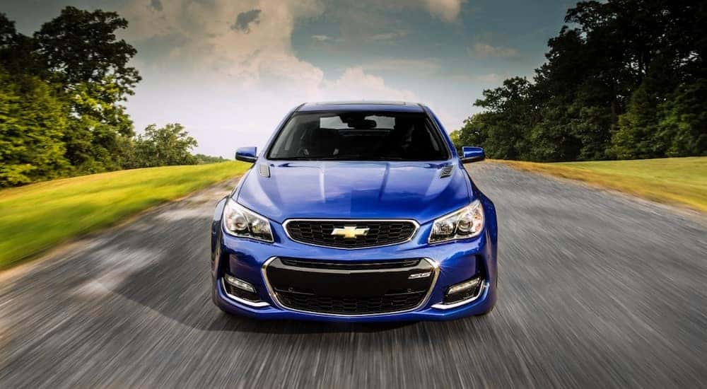 Blue 2016 Chevy SS driving down an open road.