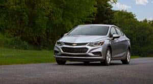 A silver 2016 Chevy Cruze parked off-road.