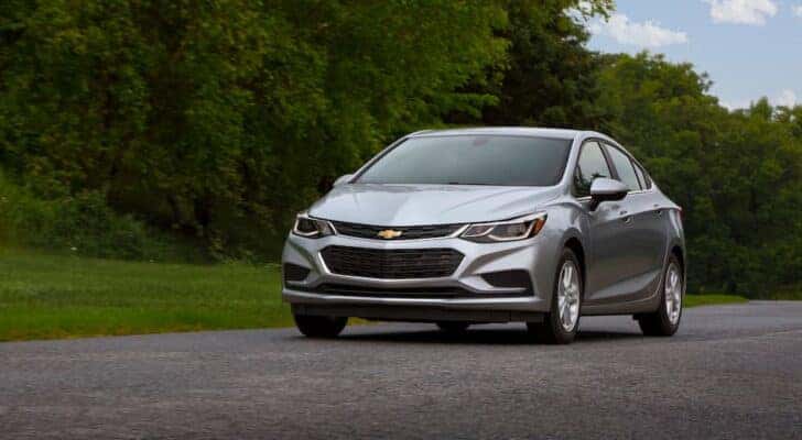 A silver 2016 Chevy Cruze parked off-road.