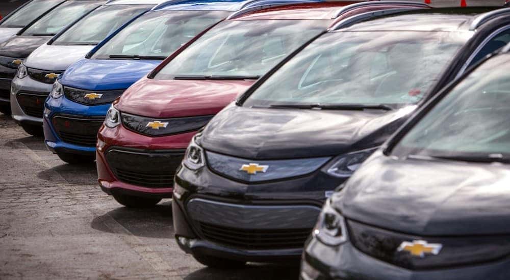A lineup of seven 2017 Chevy Bolt EVs.