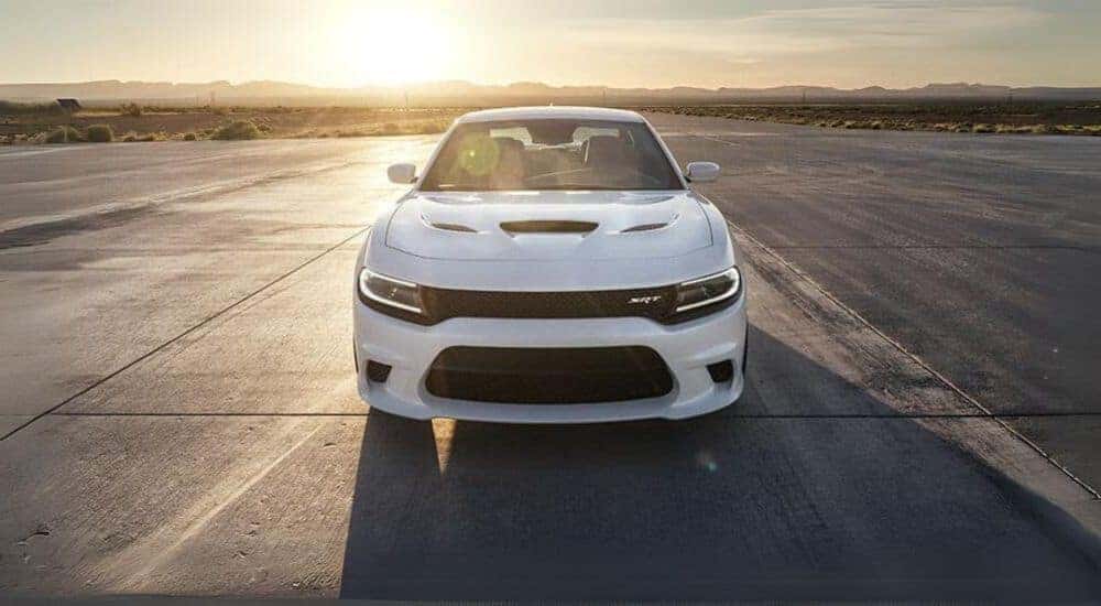 A white 2017 Dodge Charger SRT parked on a track.