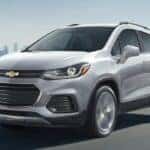 A silver 2021 Chevy Trax driving down a highway