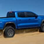 A blue 2025 Chevy Colorado ZR2 off-roading.