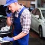 A technician is using a cellphone at a Toyota service center near Florence.