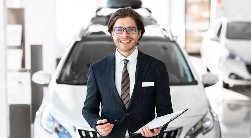 A salesman holding a clipboard.