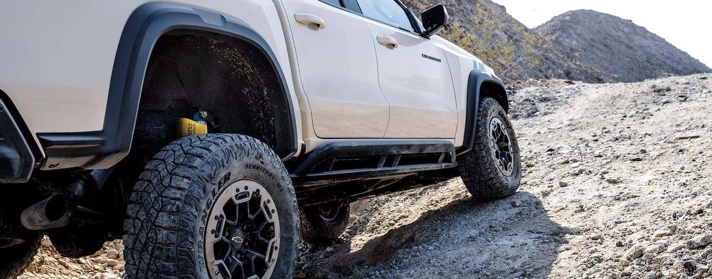A white 2025 Chevy Colorado off-roading