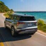A silver 2026 Chevy Equinox driving on a highway.