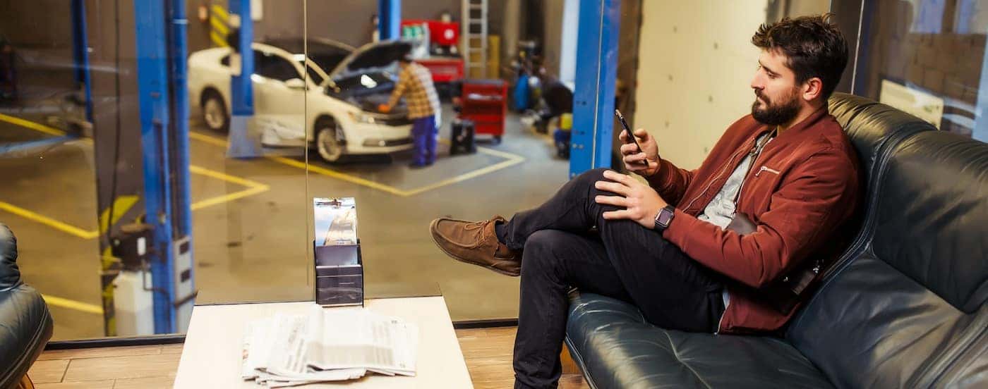 A person sitting at a Ford service center near Covington.