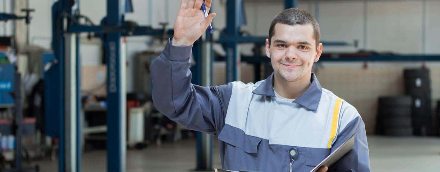 A technician waving.