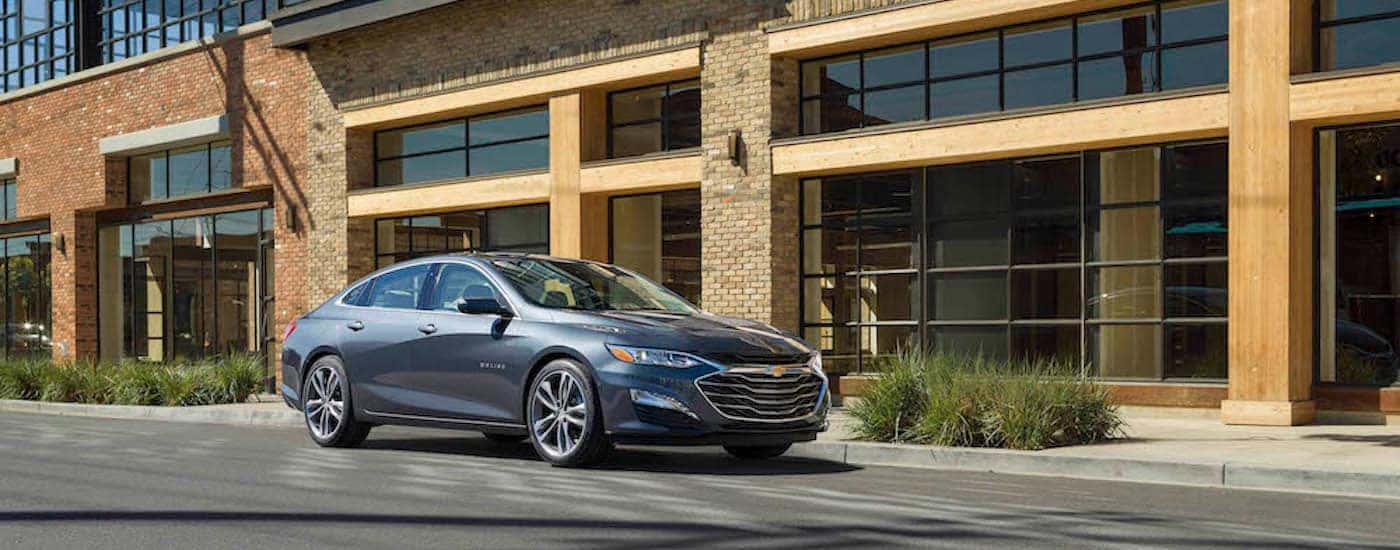 A grey 2021 Chevy Malibu from the front at an angle.