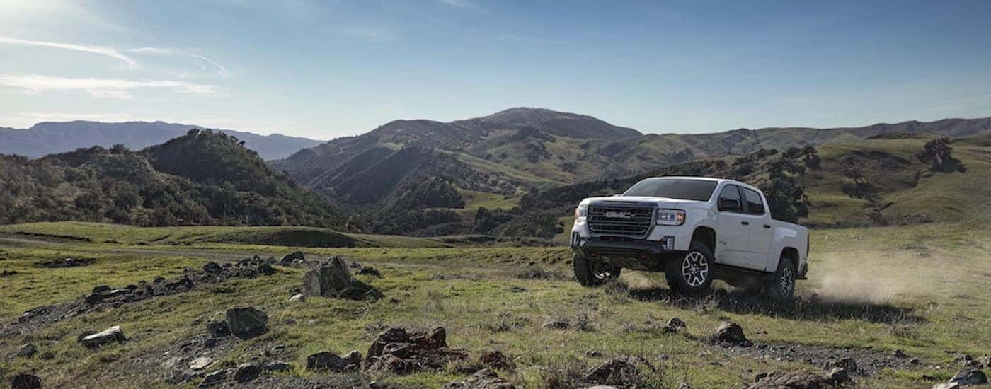 A white 2022 GMC Canyon from the front after leaving a dealer that has used cars for sale near Newport.
