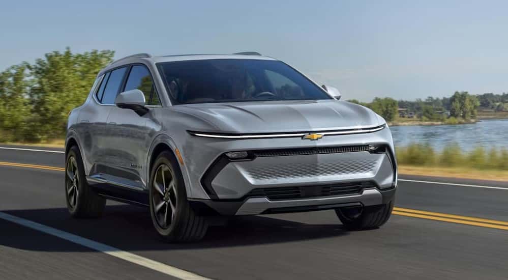 A silver 2024 Chevy Equinox EV riding on highway.