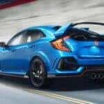 A blue 2020 Honda Civic Type R from the rear at an angle.