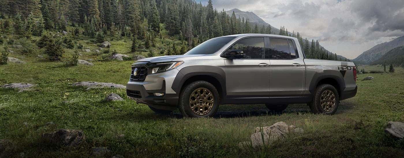 A silver 2021 Honda Ridgeline from the side.