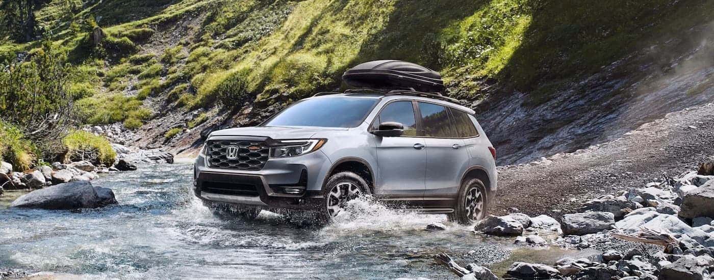 A silver 2021 Honda Passport from the front at an angle.