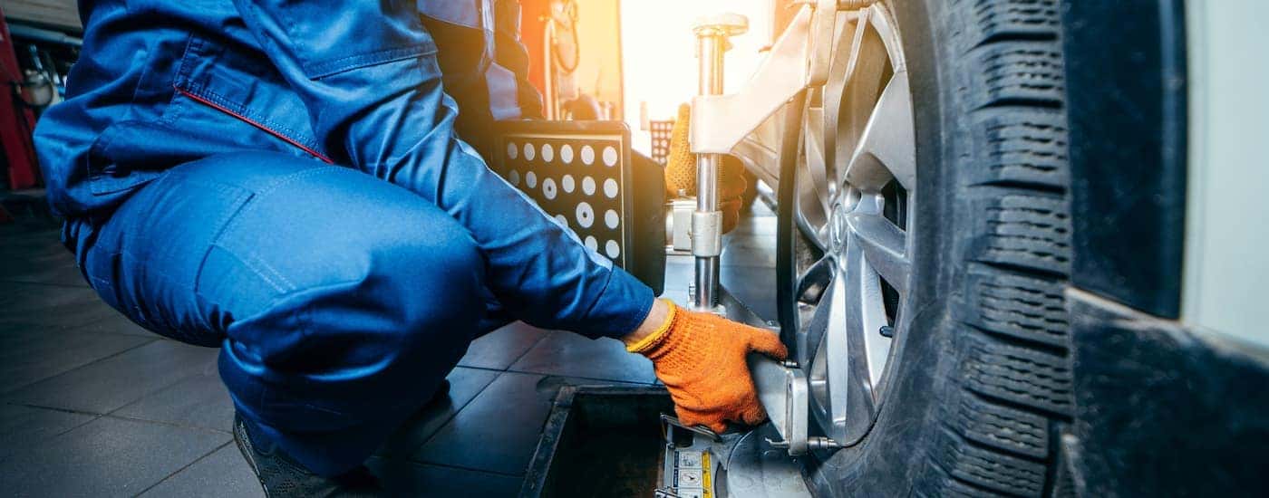 Car mechanic working on a tire.