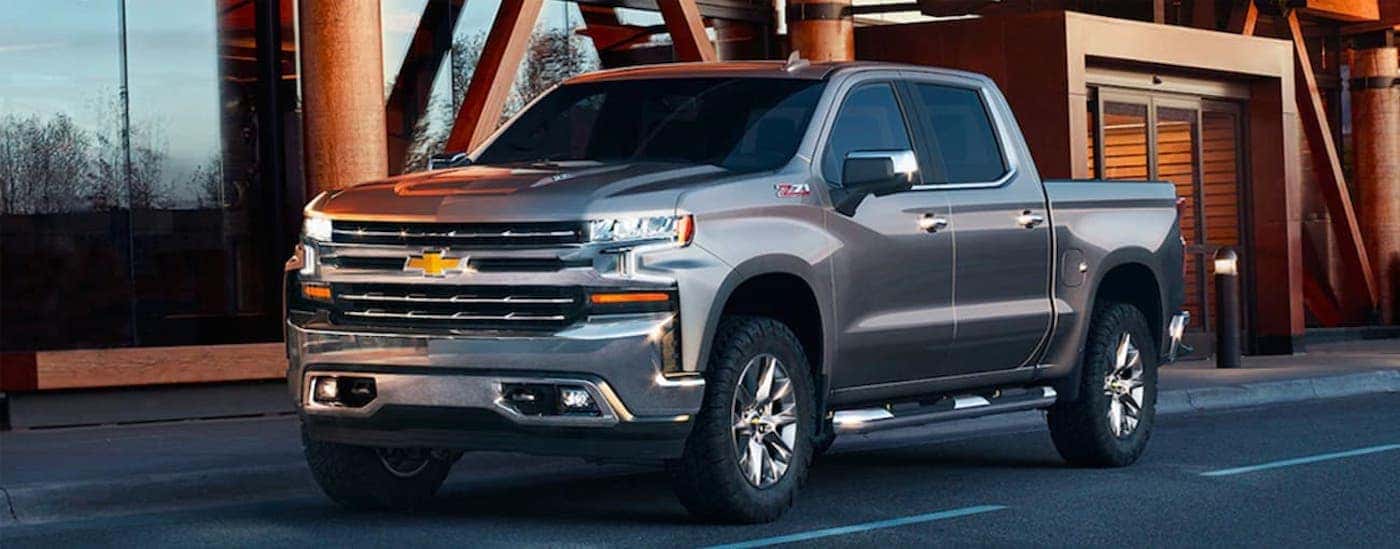Silver 2019 Chevy Silverado 1500 Z71 parked outside a building.