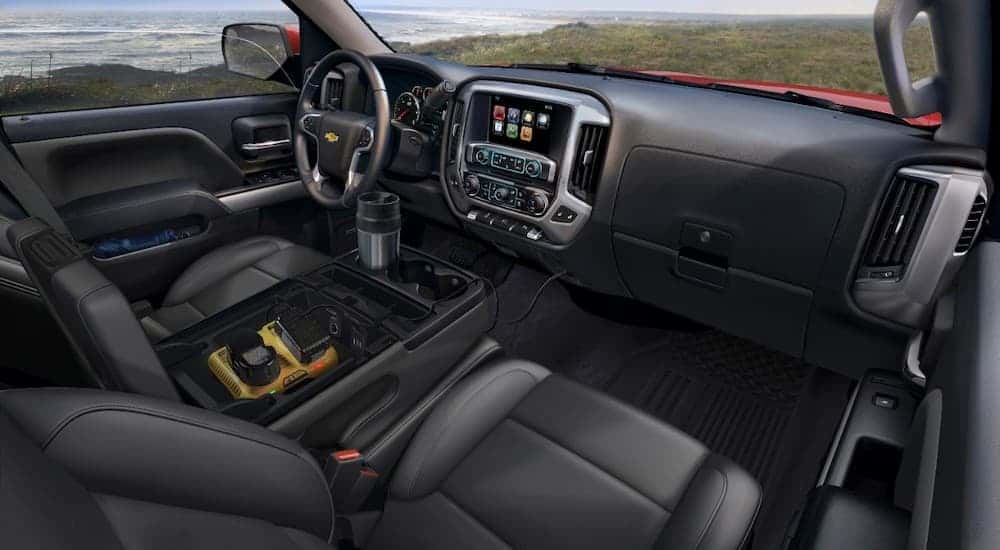 The black interior and dash in a 2015 Chevy Silverado 1500.