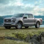 A silver 2021 Ford F-150 parked near a cliff.