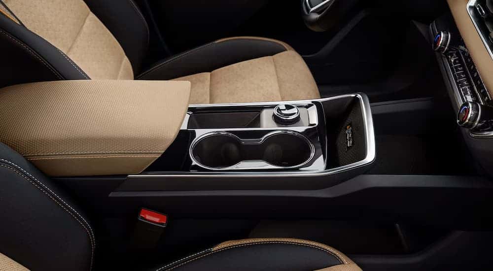Center console and tan leather seat in a 2025 Chevy Equinox