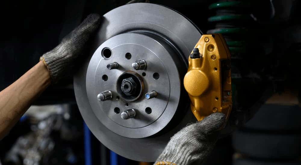 Mechanic replacing a brake rotor