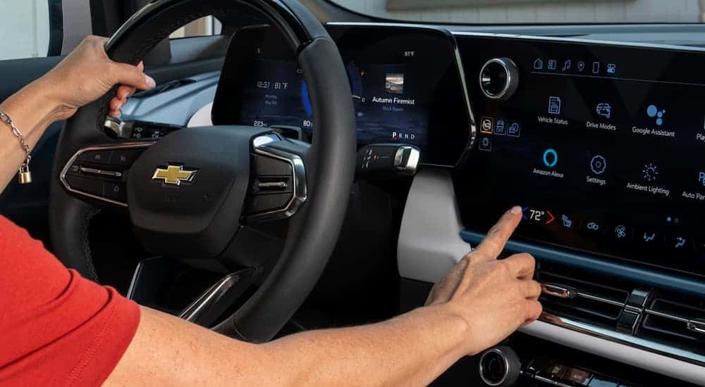 Person using infotainment screen in a 2025 Chevy Equinox EV