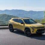 Yellow 2025 Chevy Trax ACTIV overlooking mountains