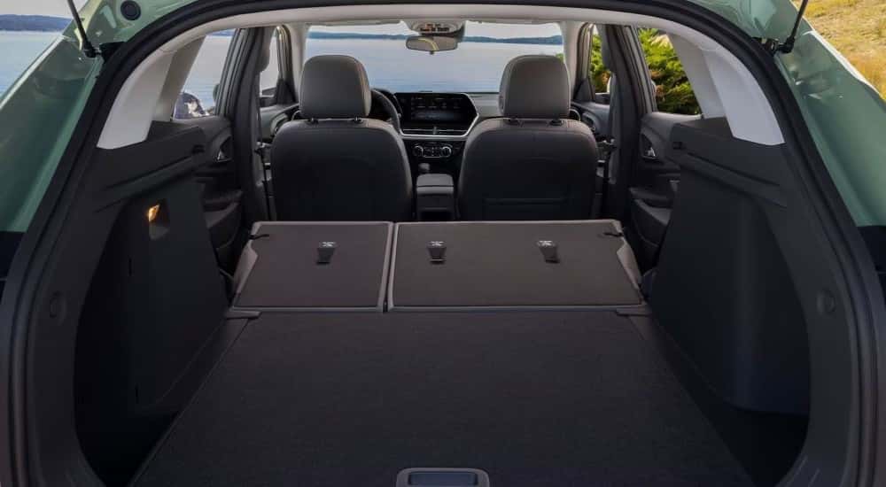 Rear seats folded in a green 2025 Chevy Trax