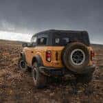Yellow 2022 Ford Bronco Black Diamond parked off-road