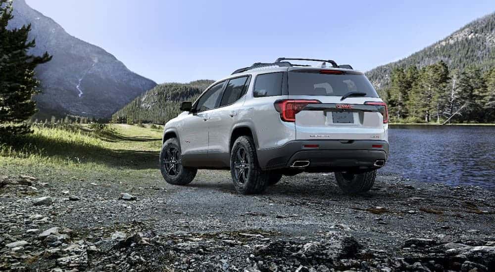 White 2020 GMC Acadia parked near a river
