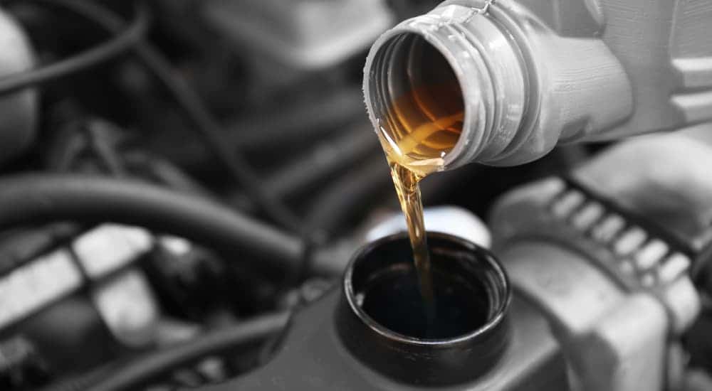 Oil pouring out of a bottle at a GMC service center near Mason