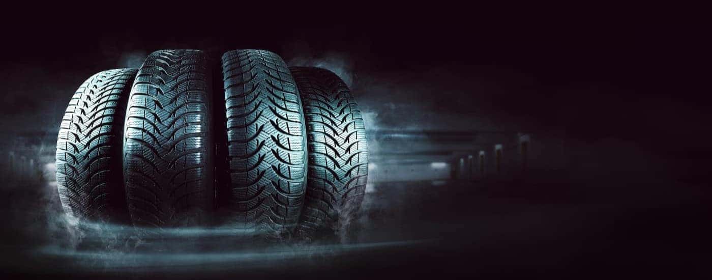 Four tires lined up in a row.