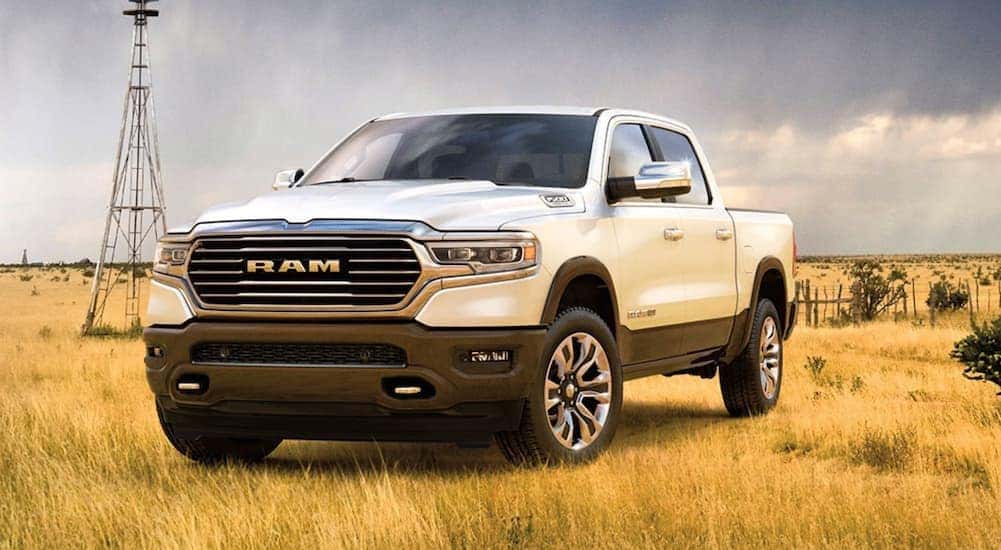 White 2020 Ram 1500 Laramie Longhorn driving off-road.