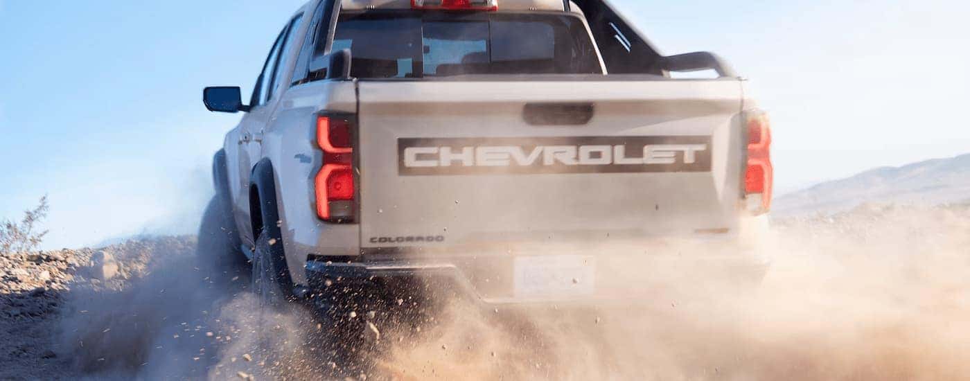 Grey 2025 Chevy Colorado off-roading on a dusty trail