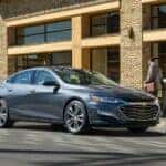 Grey 2020 Chevy Malibu parked outside on the street.