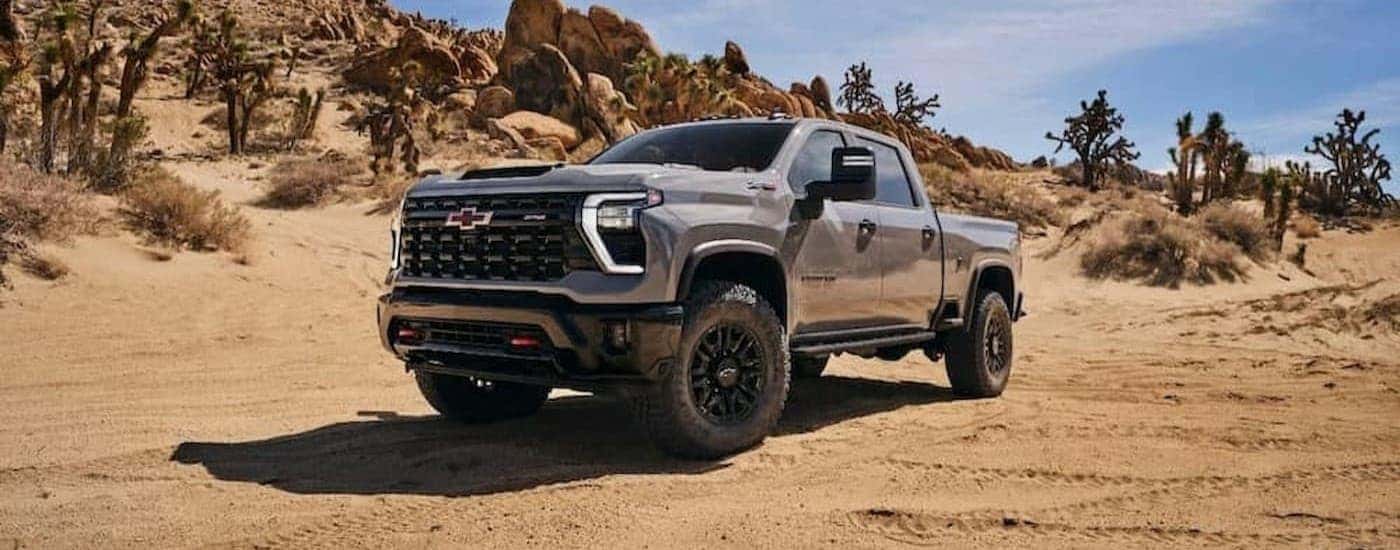 A gray 2024 Chevy Silverado 2500 ZR2 parked off-road.