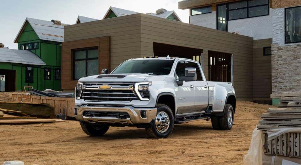 White 2025 Chevy Silverado 2500 HD for sale in Cincinnati parked in a construction site.