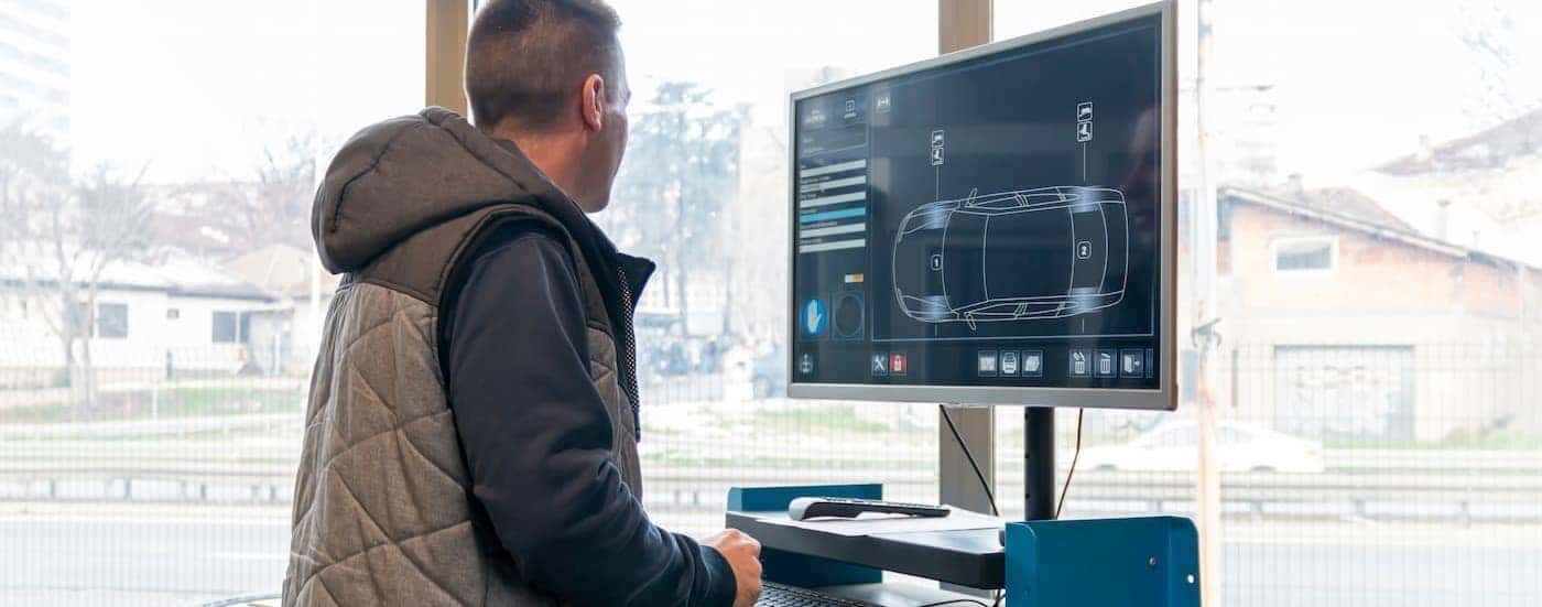 A technician running diagnostics on a computer.