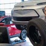 A person gets a new tire to put on to a Chevy Bolt EV