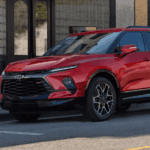 Red 2025 Chevy Blazer RS parked on the side of the street