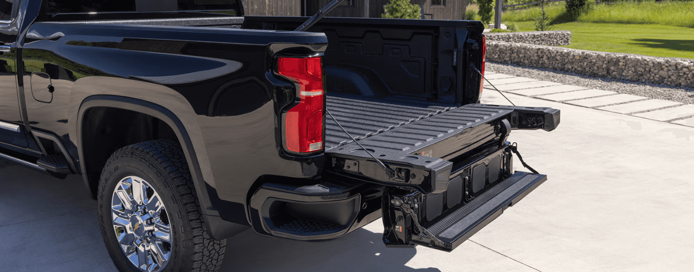 The bed of a 2026 Chevy Silverado 3500 HD with the bed step deployed