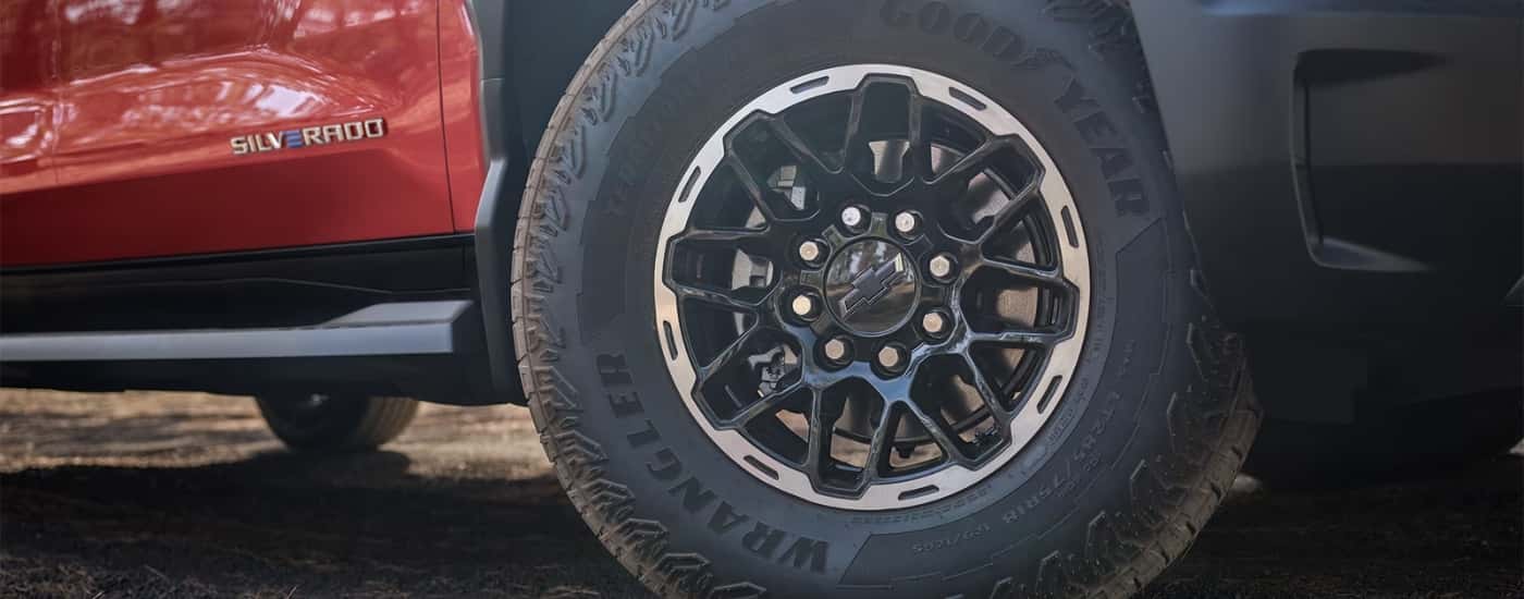 Wheel on an orange 2026 Chevy Silverado EV Trail Boss