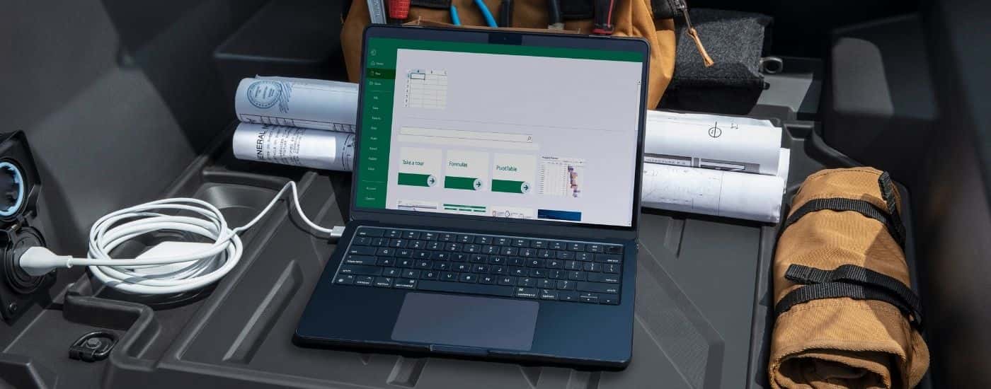 Laptop in the bed of a 2026 Chevy Silverado EV WT