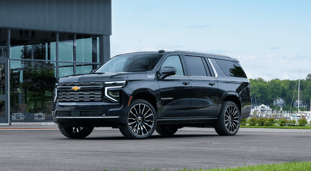 Black 2026 Chevy Suburban High Country for sale parked in front of a dealer