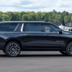 Side profile of a black 2026 Chevy Suburban High Country