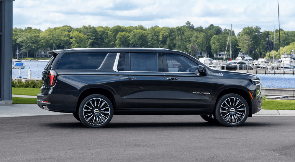Side profile of a black 2026 Chevy Suburban High Country